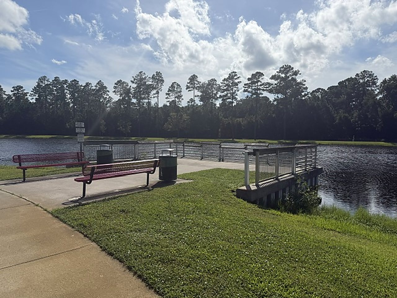 Benches and a covered fishing pier on the lake at North Glynn Recreation Complex, Brunswick, Georgia.